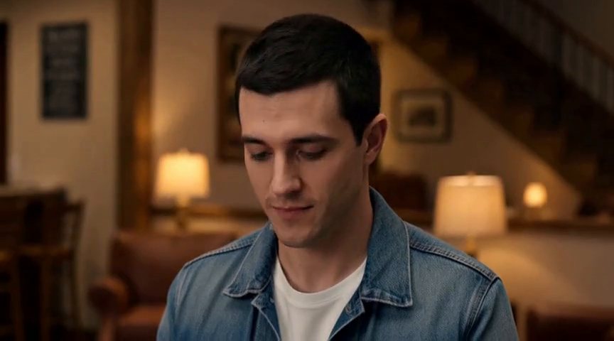 Frame from the Theo decides, glancing down at their hands before he acts clip